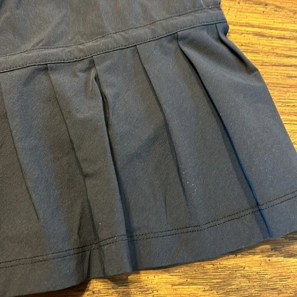 FlirTee Asymmetrical Pleated Golf Skirt - Picture 8 of 13
